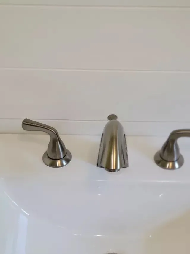 Spotless bathroom sink with brushed metal faucet in Southington CT