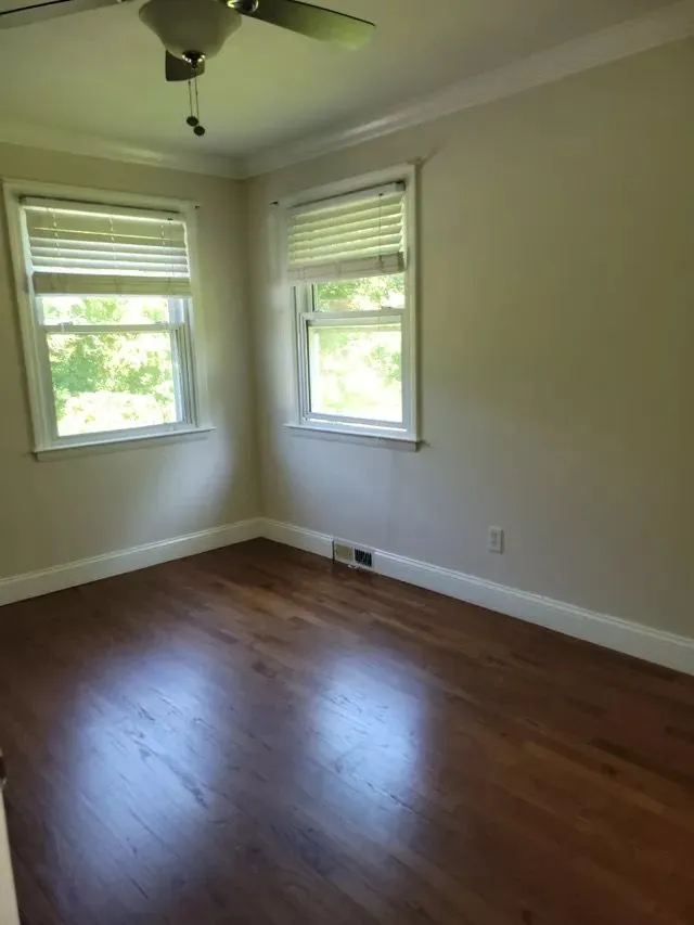 Sunny, clean bedroom with shining hardwood floors in Hartford County, Connecticut