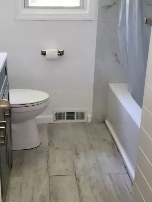 Sanitized bathroom floor cleaned by Natassia Amazing Cleaning in New Haven, CT
