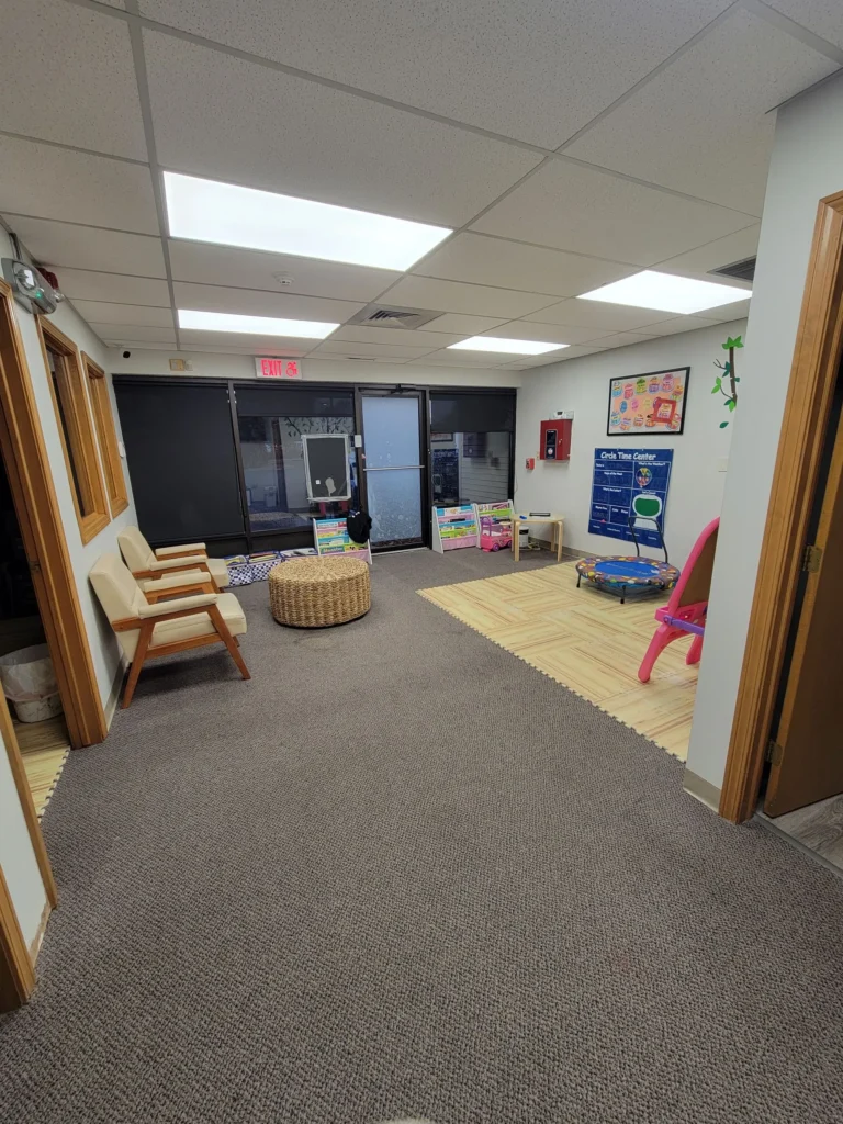 Clean daycare entry with chairs, play area, and organized space in Bristol, Connecticut