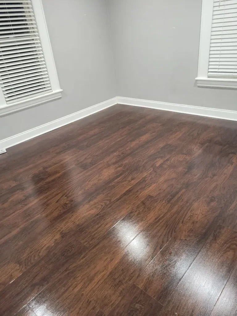 Deep cleaned empty room with polished dark wood floors in Hartford, CT