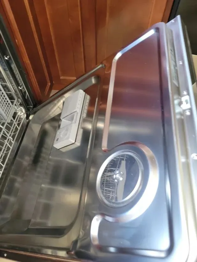 Open stainless steel dishwasher interior cleaned in Stamford, CT