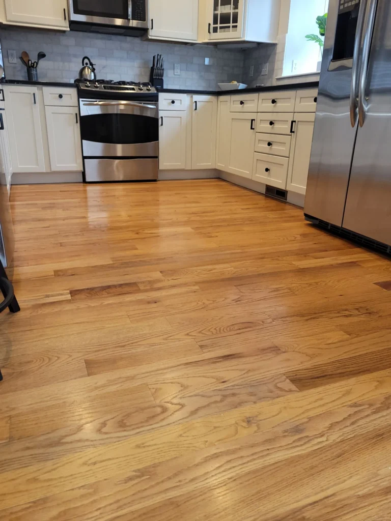 Clean hardwood kitchen floor after move-in cleaning service in Avon, Connecticut