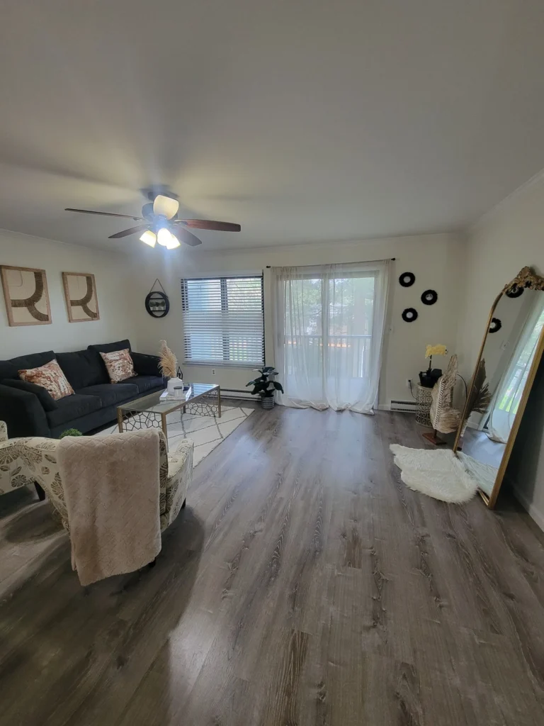 Cozy, modern living space with clean floors and bright decor in New Haven, CT