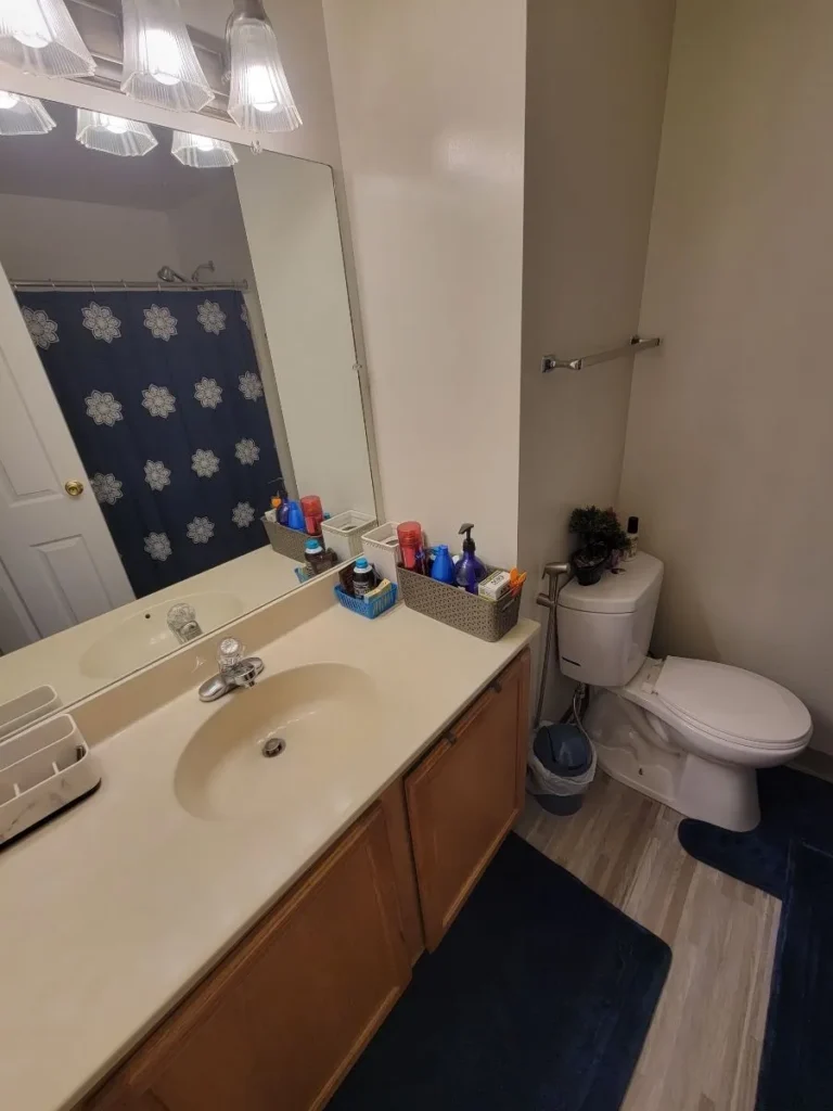 Clean bathroom vanity and toilet area after a professional monthly cleaning in Southington, Connecticut