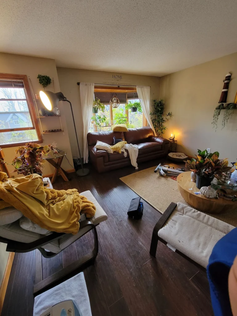 Disorganized living room in New Britain Connecticut before cleaning