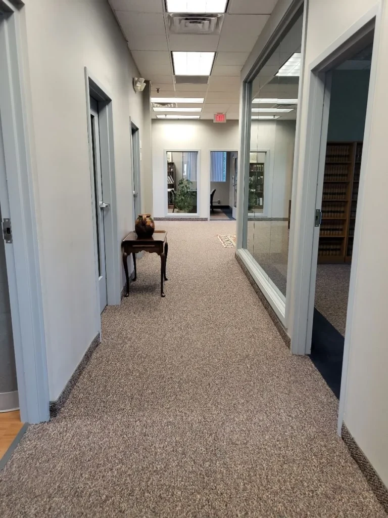Clean hallway in law office with doors and indoor plants in Avon, Connecticut