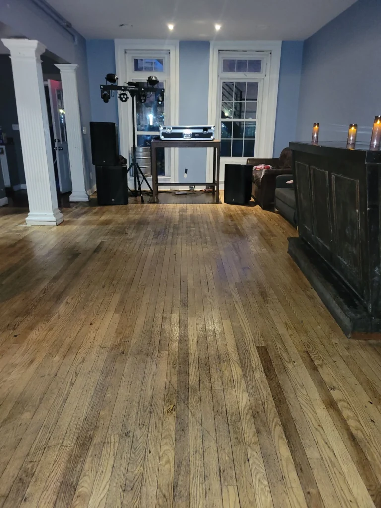 Clean polished hardwood floors in event room after deep cleaning service in Bristol, CT