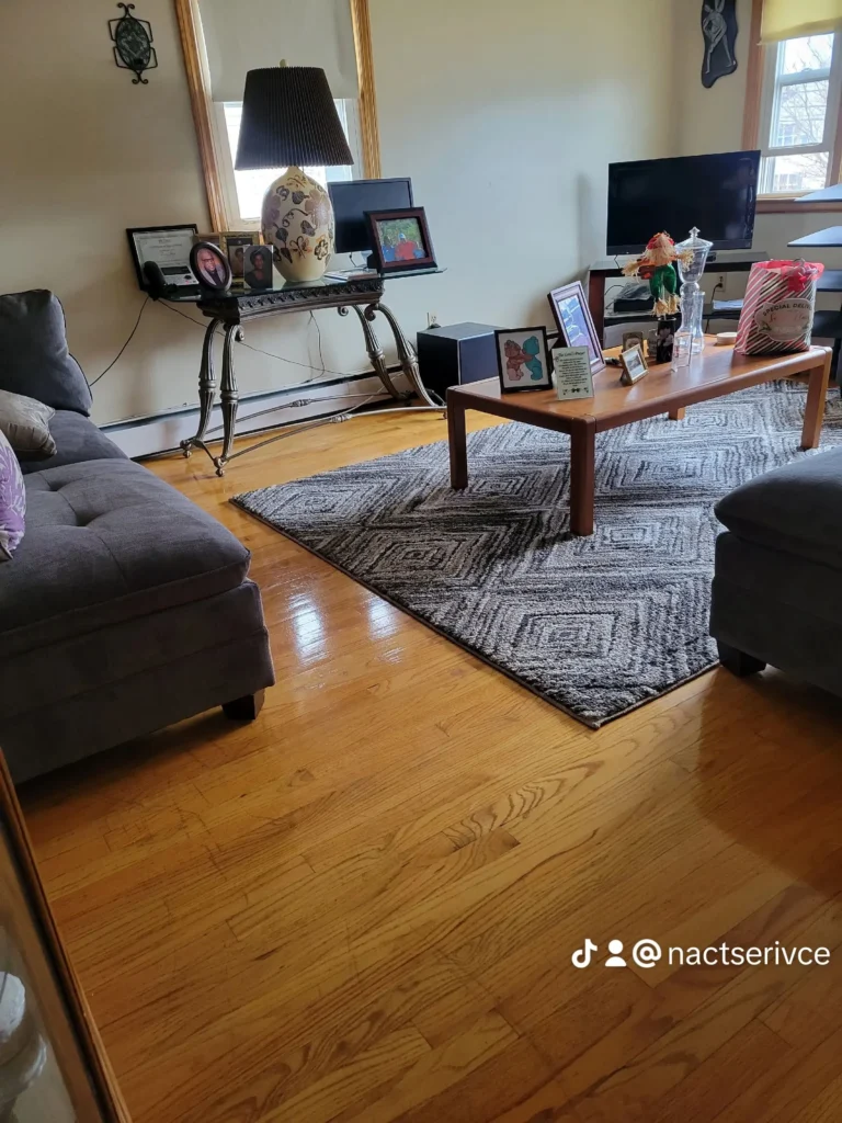Clean living room with gleaming hardwood floors in New Britain, CT