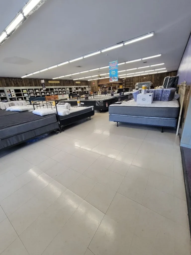 Clean tile floors and display beds at retail mattress store in Hartford, Connecticut