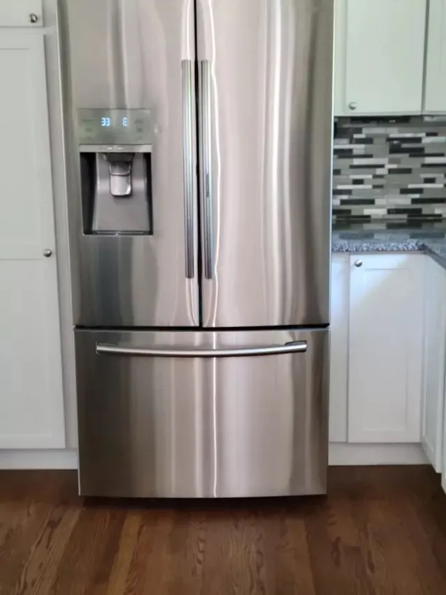 Clean stainless steel fridge in Southington CT kitchen after deep appliance cleaning