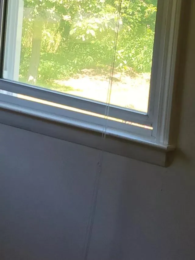 Clean window trim and sill with outdoor light streaming in at a Hartford, Connecticut home